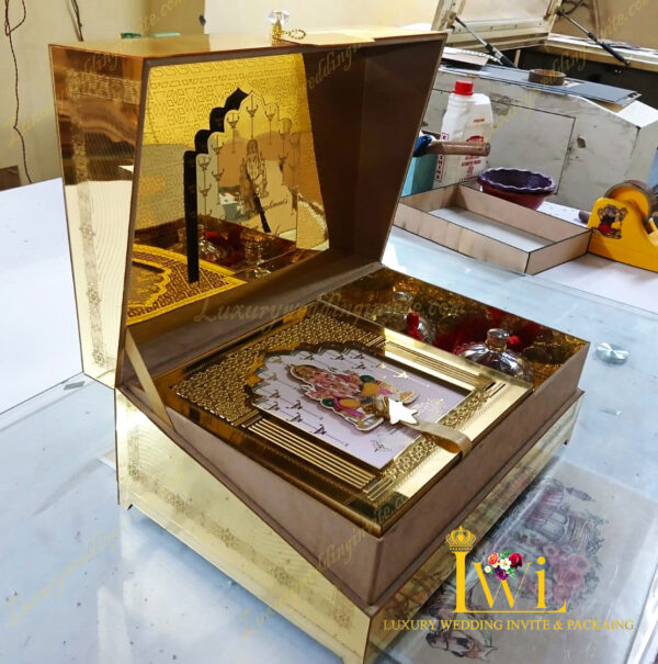 Lord Shri Ganeshji Wedding Invitation Golden Box Design By Luxury wedding invite & packaging lef side look